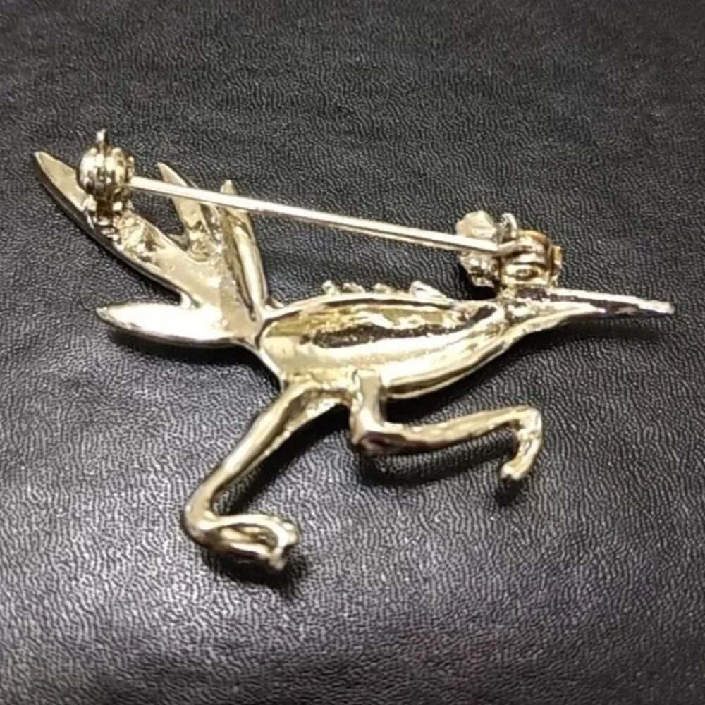 Silver tone vintage roadrunner brooch.